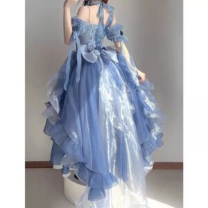 A Lolita puffy dress with a short front and a long back, featuring blue flowers and a trailing tail