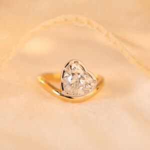 New custom 14k yellow gold 2.5ct heart-shaped lab diamond ring with white gold bezel and wave band