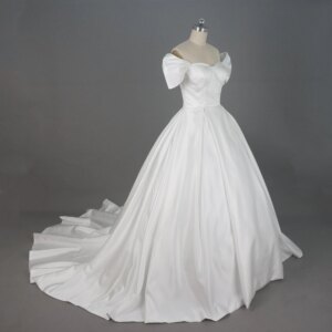 Elegant Off the Shoulder Satin Wedding Dress with Big Bow Sleeves and Flowing Long Train for Dreamy Bridal Look
