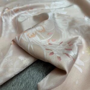 A new Chinese-style top and coat set made of silk woven gold double-sided differently colored brocade fabric featuring