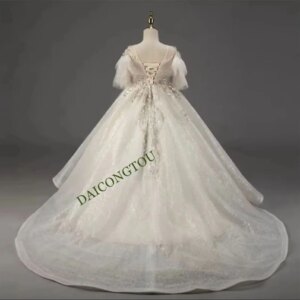 Customized Luxury Customized Flower Girl Dress For Wedding Puffy Tulle Feather Sleeve Beaded Kids Pageant Party First Communion