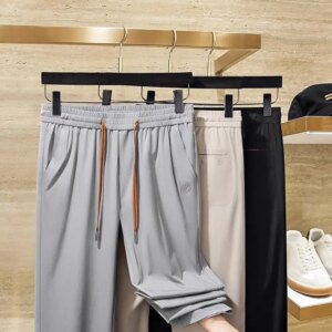 Summer high-end anti-wrinkle solid color fast dry ice silk sports pants non-trace pressure glue men slim straight sweatpants cas