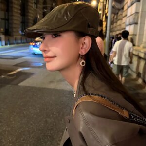 Brown reverse beret woman outdoors in hat street taking leather painter’s hats