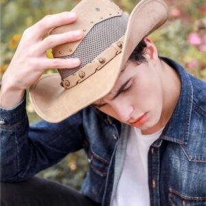 Vintage old leather men’s and women’s khaki belts outdoor sunshade large brimmed country cowboy hats