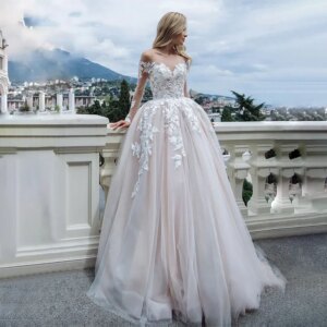 Elegance Modern A Line Wedding Dress Sexy Sheer Boat Neck Appliques Bridal Gown Illusion Back Button Tulle Sweep Train Dresses