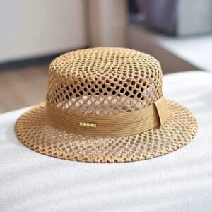 A new flat-top breathable hand-woven hat with hollowed-out design for vacation and travel providing shade