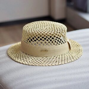 A new flat-top breathable hand-woven hat with hollowed-out design for vacation and travel providing shade