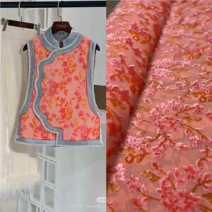 High-end custom-made new Chinese-style armor shawl fabric made of orange silk corned floral fleece