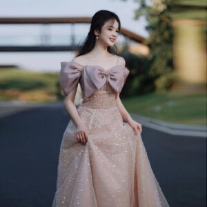 Starry Pink Celebrity Dresses Floor Length Off the Shoulder Sequins Bow Strapless Graduation Prom Performance Gowns 2024