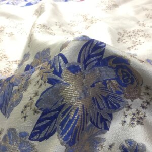 The jacquard dress for evening is made of fashionable gold silk brocade fabric