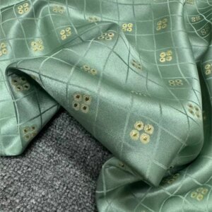 The new high-end custom product is made of pure silk woven gold jacquard fabric for wide-width outerwear and suit clothing