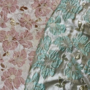 The lustrous and puffy skirt dress are made of pink green gold silk embossed jacquard fabric a designer’s fashion