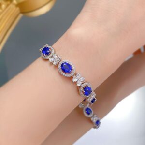 Sleek S925 Sterling Silver Bangle Adorned by Vibrant Oval Shape 6x8mm Royal Blue Sapphire Gemstone