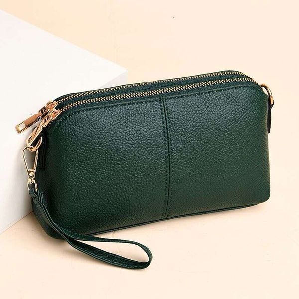 Handheld for women 2025 new fashion Korean version soft leather single shoulder versatile multi-layer small bag hand-held shell bag