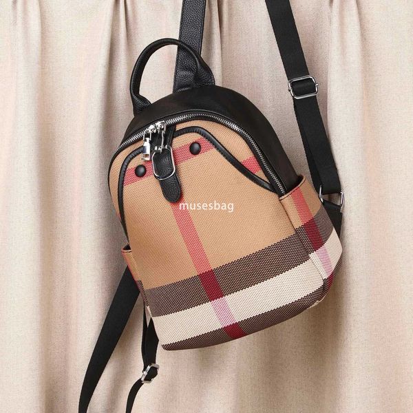 A niche design European and American retro leather canvas backpack women's new daily travel backpack commuting essential crossbody bag handbag