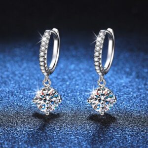 Women's Elegant Moissanite Studs: Platinum-Plated Silver Jewelry Pieces Featuring a Timeless Setting
