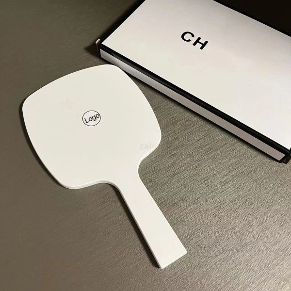 2024 new Designer holding black and white classic women's travel portable small essential makeup mirror in bag